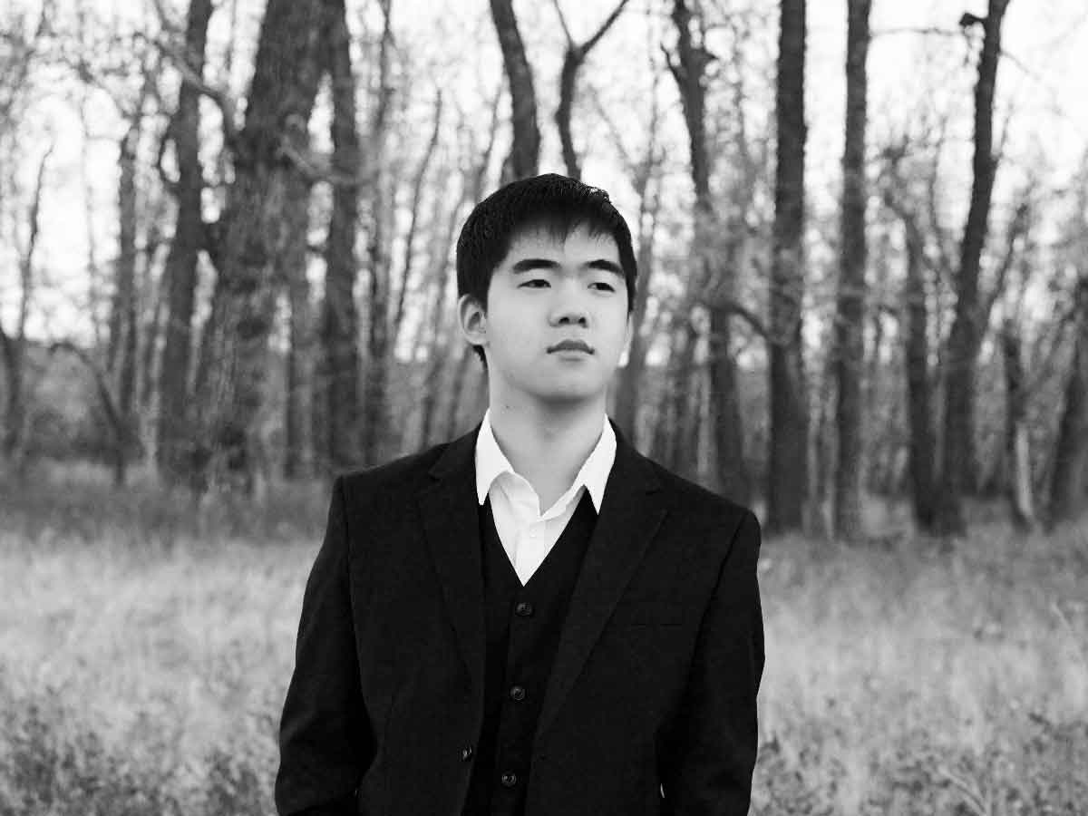 Kevin Chen, Canadian pianist, in field near Calgary Alberta