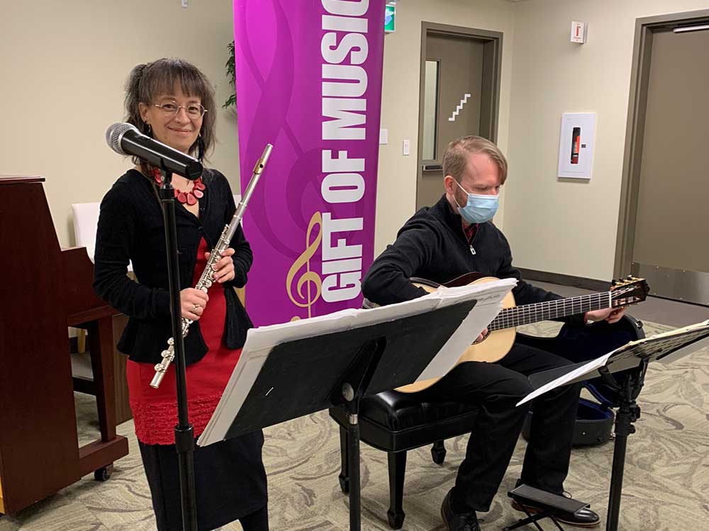 Flutist Flutist Marie-Noëlle Choquette and guitarist Charles Hobson of Duo Beija-Flor perform at an outreach event